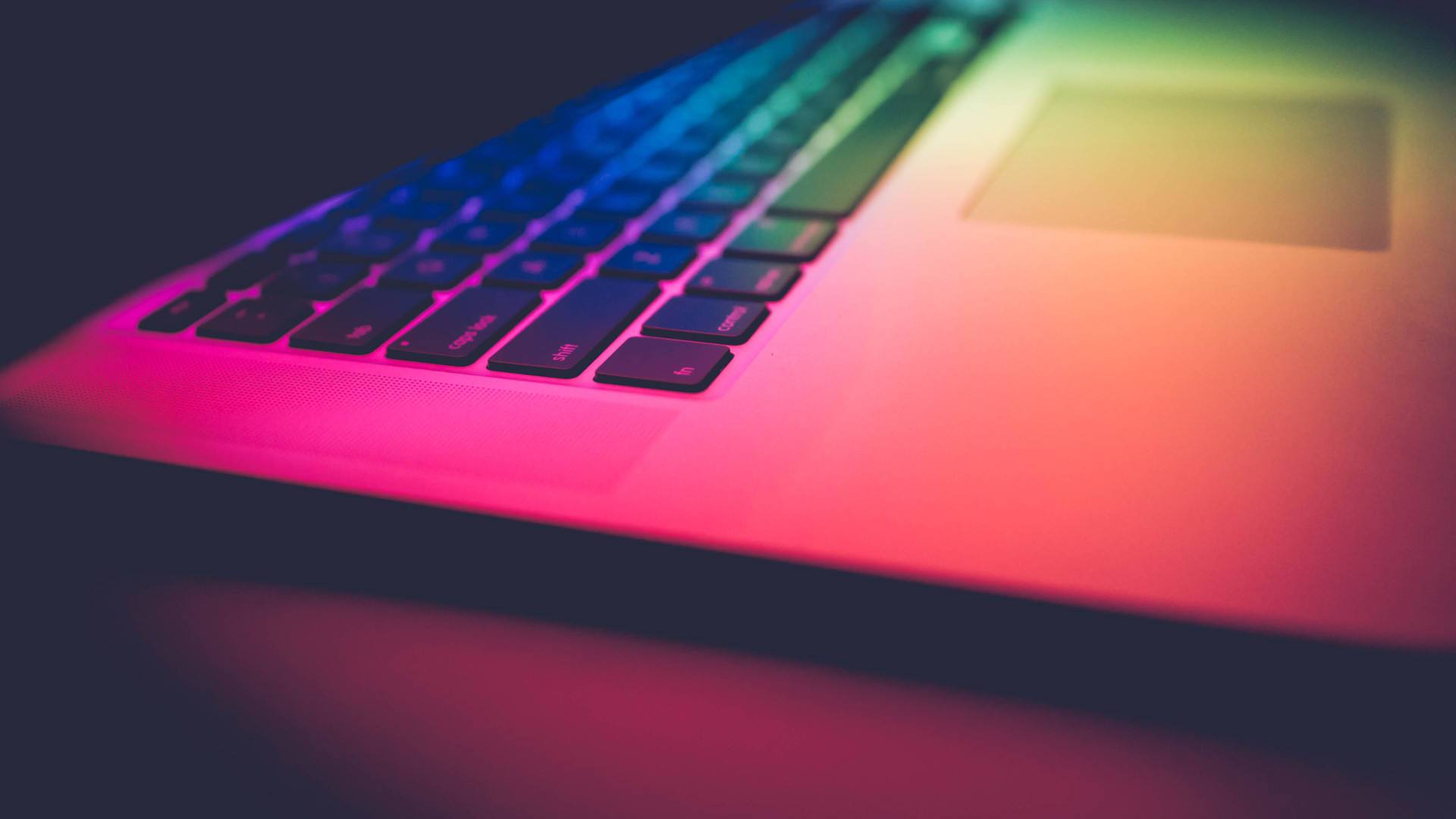 Colourful laptop keyboard background image.